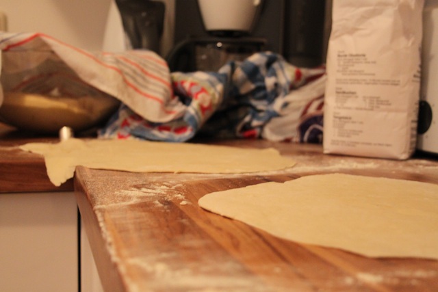 rolling out pizza dough (Eat Me. Drink Me.)