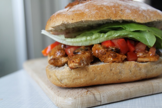 Curried chicken sandwich with raisins and pepper-tomato salsa (Eat Me. Drink Me.)