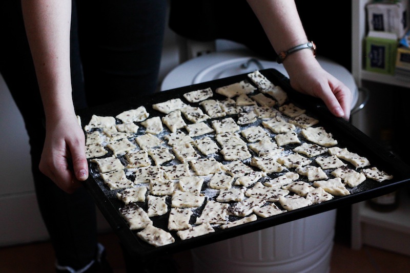 A tray of homemade crackers (Eat Me. Drink Me.)