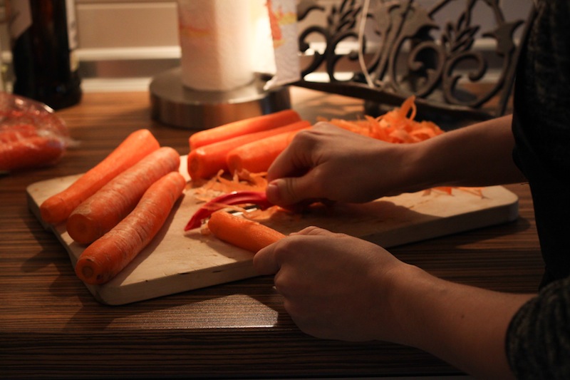 Peeling carrots for carrot cake (Eat Me. Drink Me.)