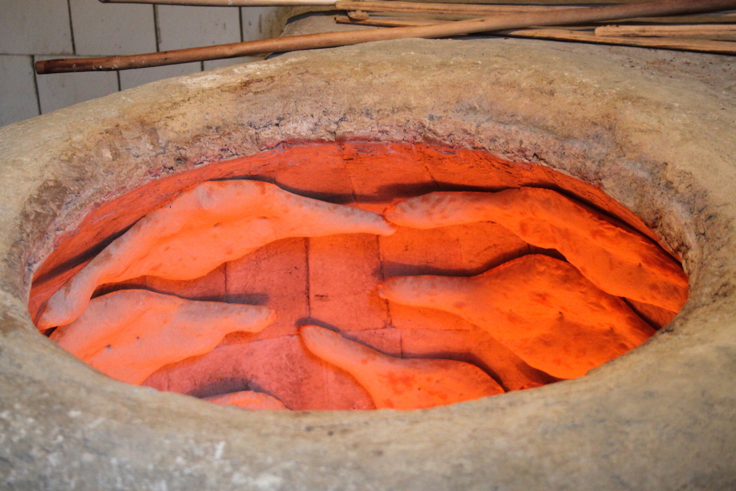 Bread baking in a tone oven (Eat Me. Drink Me.)