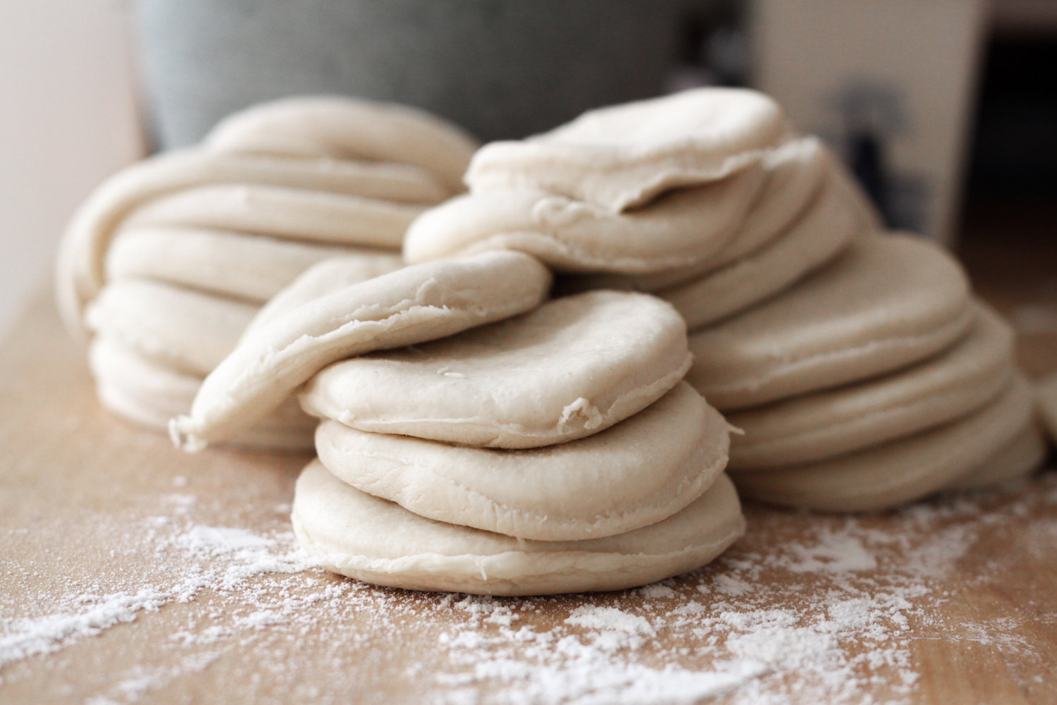 Piles of unrolled dumpling rounds (Eat Me. Drink Me.)