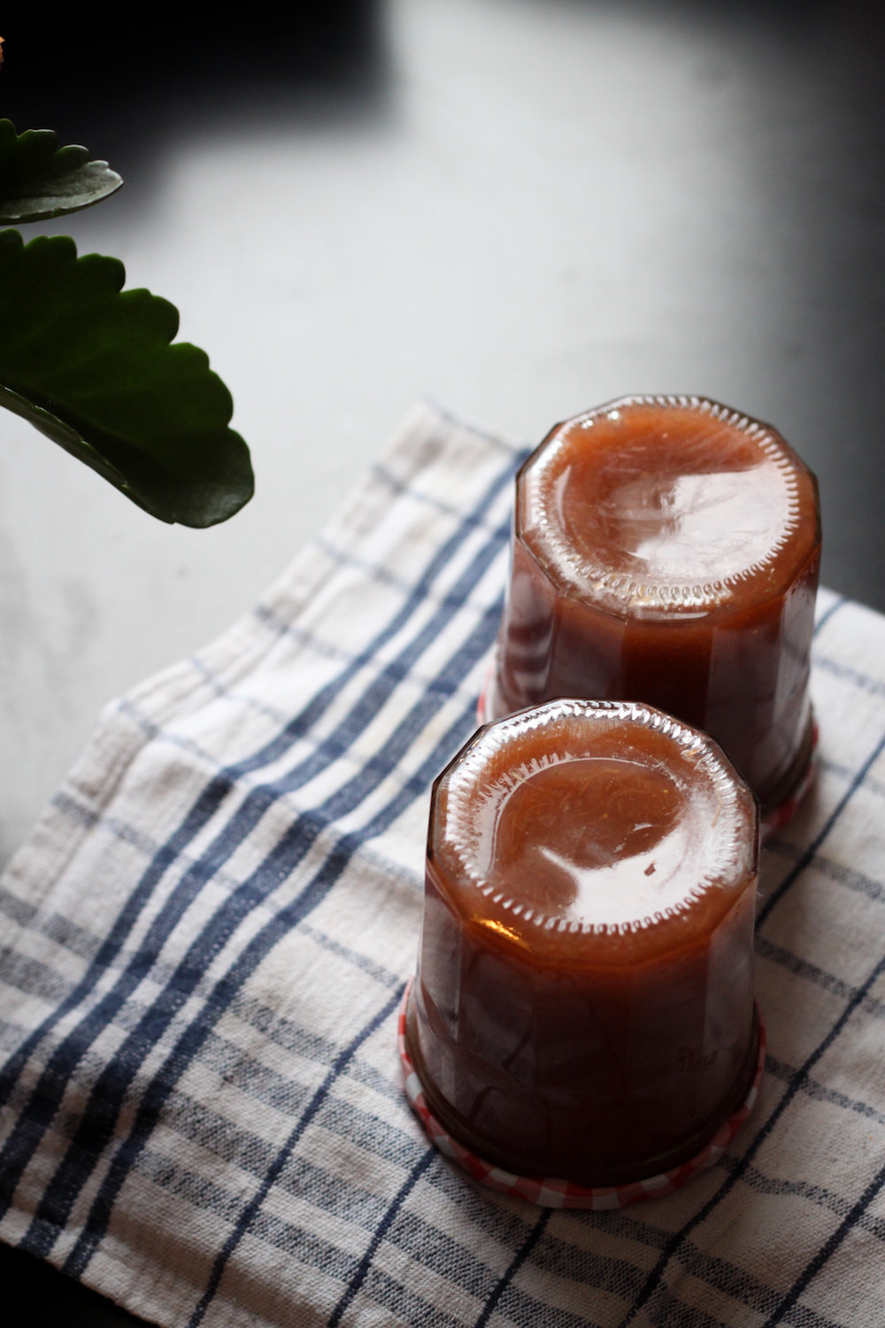 Cooling jars of strawberry-rhubarb jam (Eat Me. Drink Me.)