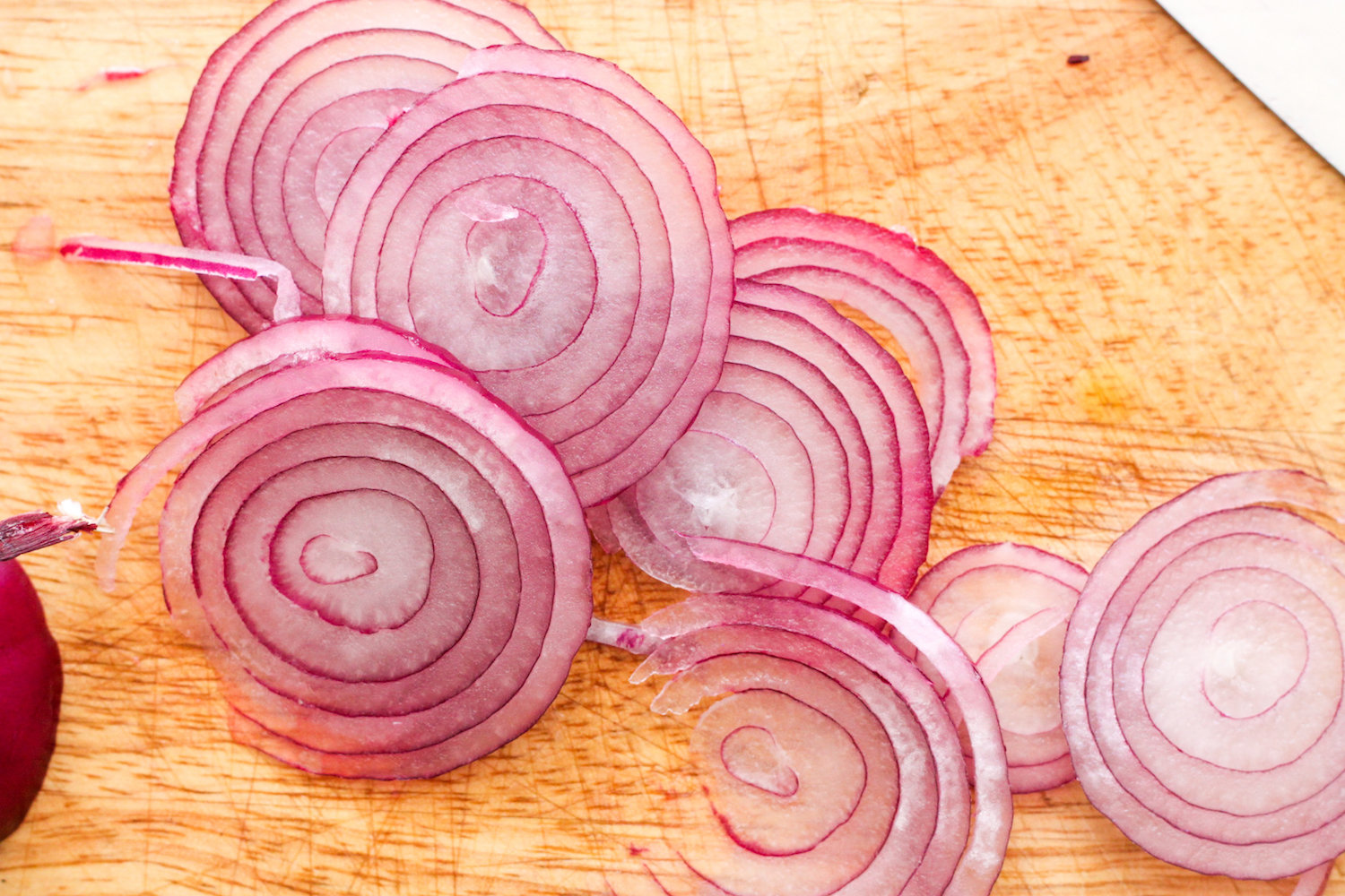 Sliced red onions (Eat Me. Drink Me.)