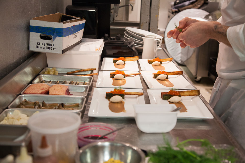 Enrique Limardo plating the first course (photo courtesy of alma cocina latina)